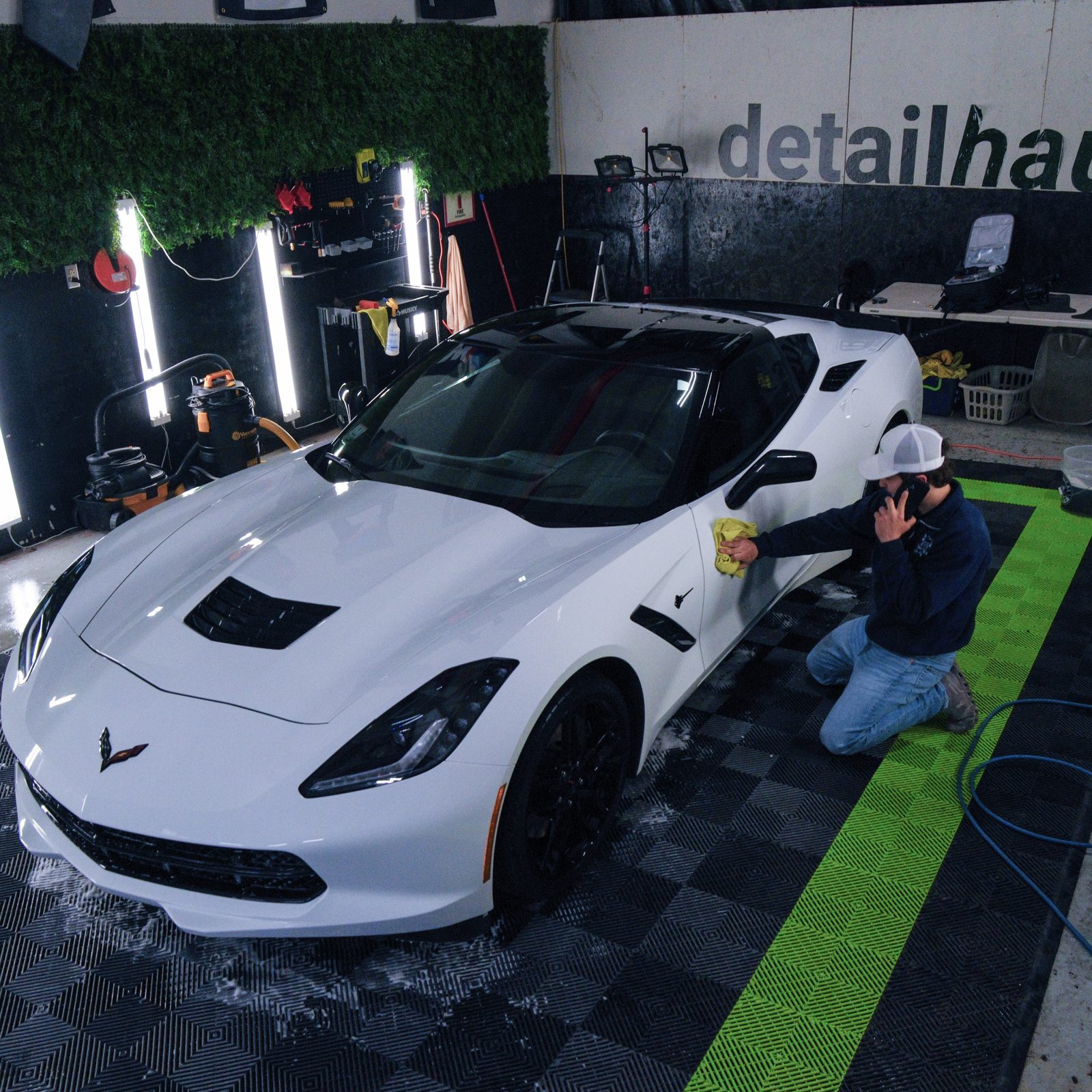 A vehicle being detailed inside the DetailHaus studio