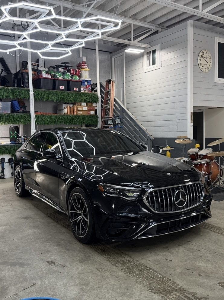 Finished Mercedes-AMG under the hex lighting at DetailHaus
